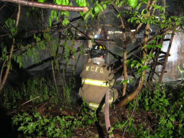 FF Helmut Schuder at the N. Wayne Street woods fire, April 2012.