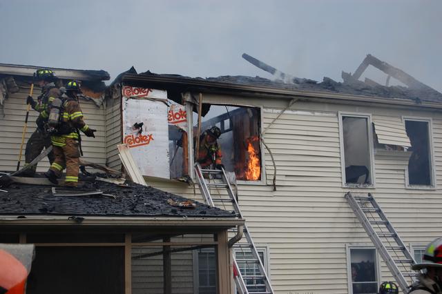 House Fire on Exeter Drive in West Goshen Township.  Pictured FF's Helmut Schuder and John Morris.  July 2010.