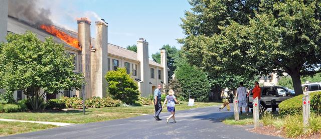 Town Home Fire in Bradford Square, East Bradford Township.  Fire showing from the roof.  August 2011.