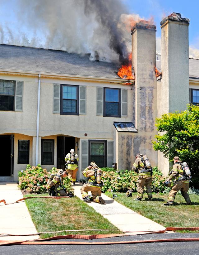 Town Home Fire in Bradford Square, East Bradford Township.  Crew from Engine 51-1 entering with the first attack line.  August 2011.