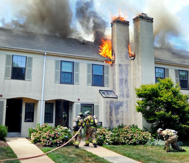 Town Home Fire in Bradford Square, East Bradford Township. Crew from Engine 51-1 entering with the first attack line. August 2011.