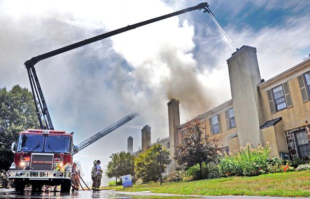 Town Home Fire in Bradford Square, East Bradford Township. Engine 51-1 going into service with the boom after the fire jumped the fire walls. August 2011.