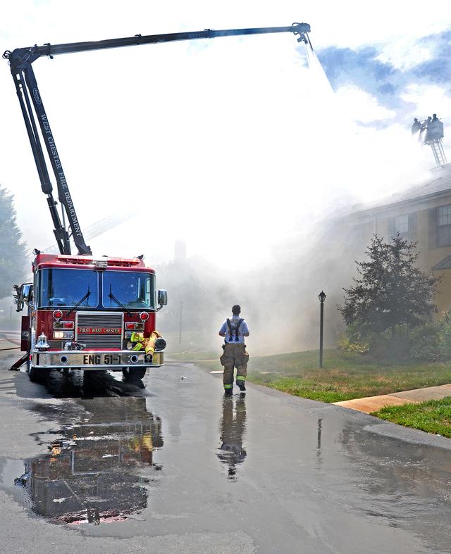 Town Home Fire in Bradford Square, East Bradford Township. Engine 51-1 going into service with the boom after the fire jumped the fire walls. August 2011.