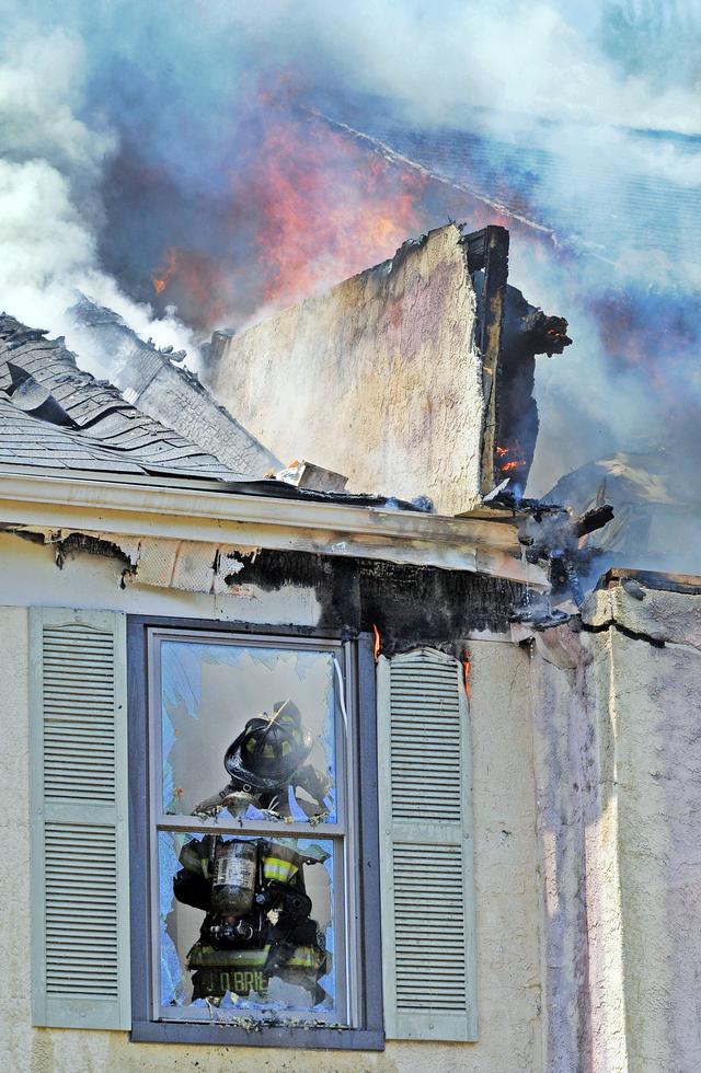 Town Home Fire in Bradford Square, East Bradford Township. Pictured Firefighter John O'Brien. August 2011.