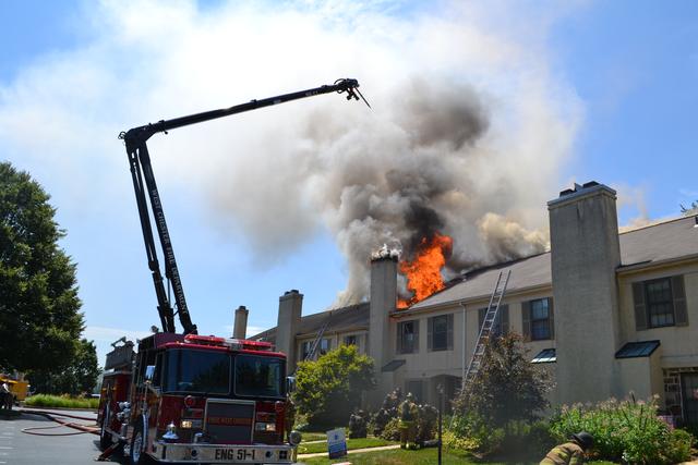 Town Home Fire in Bradford Square, East Bradford Township. Engine 51-1 going into service with the boom after the fire jumped the fire walls. August 2011.
