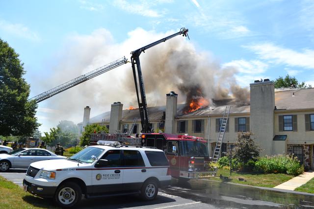 Town Home Fire in Bradford Square, East Bradford Township. Engine 51-1 going into service with the boom after the fire jumped the fire walls. August 2011.