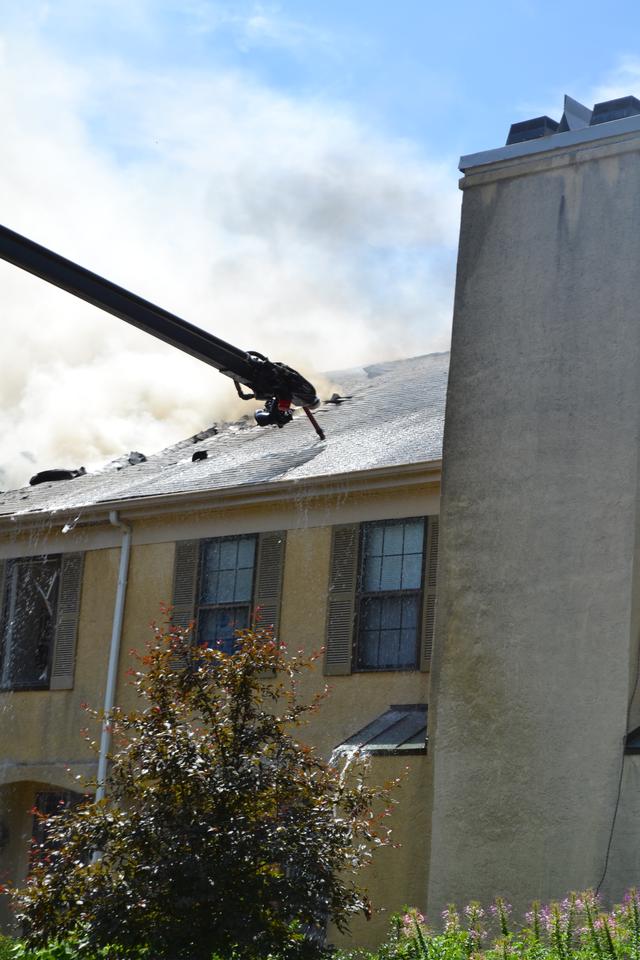 Town Home Fire in Bradford Square, East Bradford Township. Engine 51-1 going into service with the boom after the fire jumped the fire walls. August 2011.