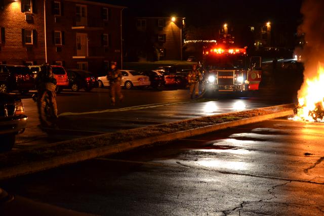 Auto Fire at Cambridge Hall Apartments in West Goshen Township. Crew stretching front bumper line for fire attack. December 2011.