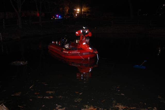 Vehicle into a pond on Hillsdale Road, East Bradford Township. Members of Station 53 checking the submerged vehicle.  February 2011.