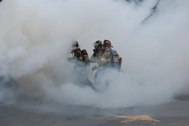 Auto Fire on W. Rosedale Avenue, West Goshen Township. Firefighters John O'Brien and Scott Joblin extinguishing the fire assisted by Lt. Green.  March 2011.