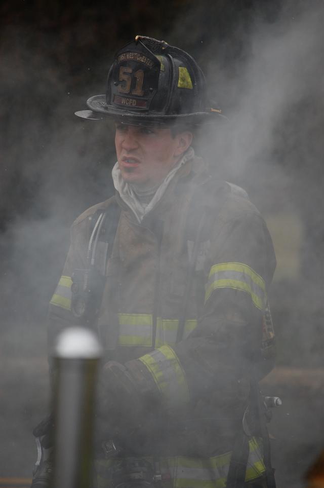 Auto Fire on W. Rosedale Avenue, West Goshen Township. Firefighter John O'Brien on the nozzle.  March 2011.