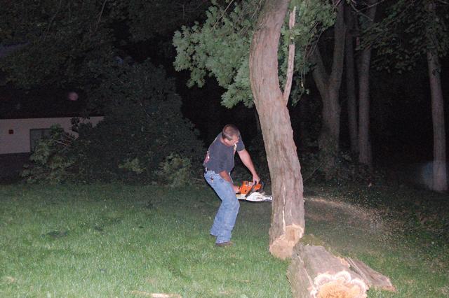 FF Jim Graham (Station 52) lending a hand at a fallen tree at the Fire House.