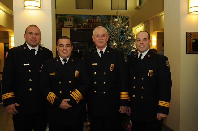 Assistant Chief John Stafford (52), out-going Chief Mike Cotter (52), Chief Dale McClure, and Assistant Chief Steve Pelna.